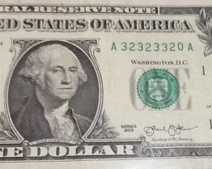 An-Odd-Serial-Number-On-A-2013-$1-Bill