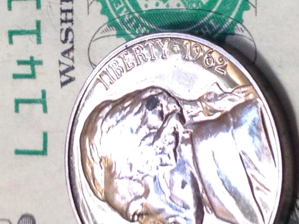 Black-Gunck-On-A-Proof-Coin.
