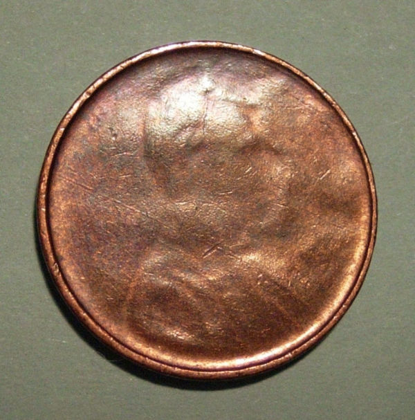 Lincoln-Memorial-Cent---Obverse-Struck-Through-Die-Cap?
