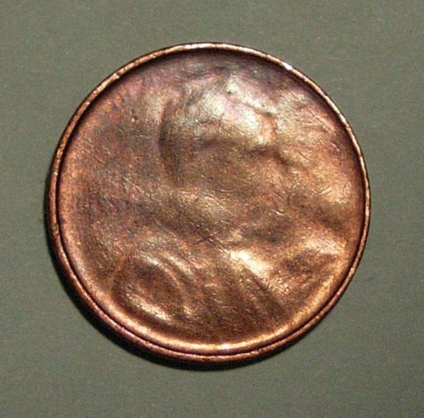Lincoln-Memorial-Cent---Obverse-Struck-Through-Die-Cap?