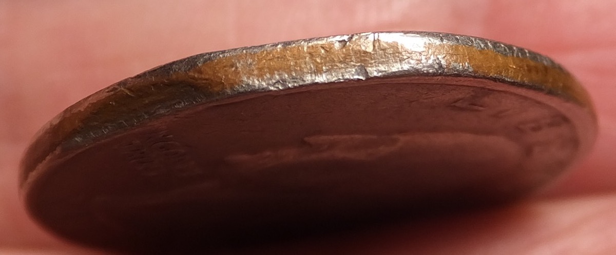 1977-Quarter,-Clipped-Planchet-Or-PMD?