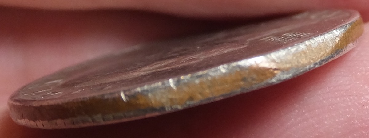1977-Quarter,-Clipped-Planchet-Or-PMD?
