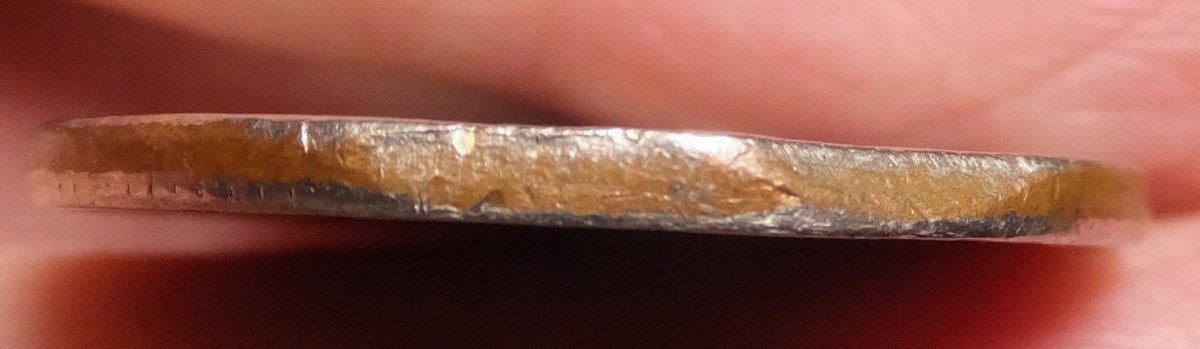 1977-Quarter,-Clipped-Planchet-Or-PMD?