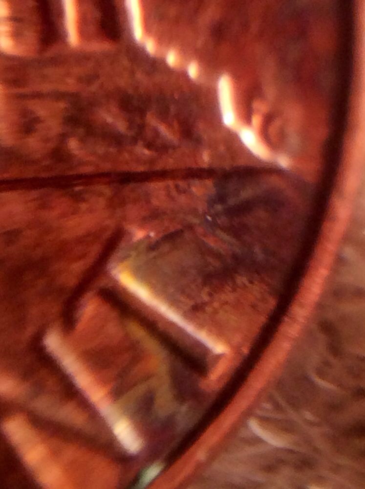 Is-This-From-Someone-Squeezing-Something-On-This-Penny