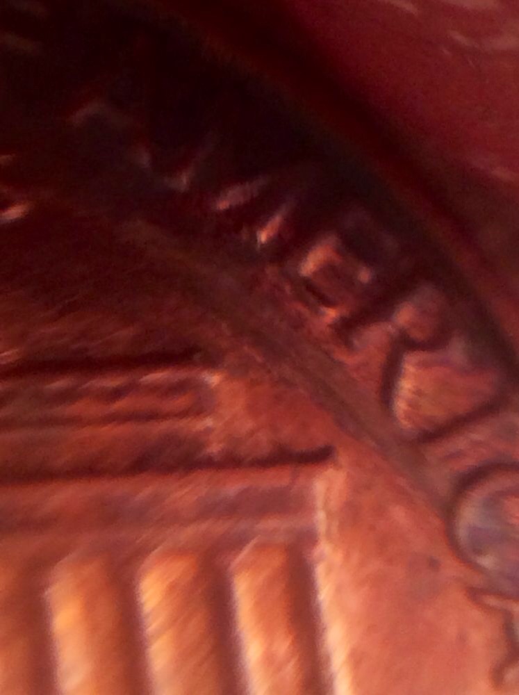 Is-This-From-Someone-Squeezing-Something-On-This-Penny