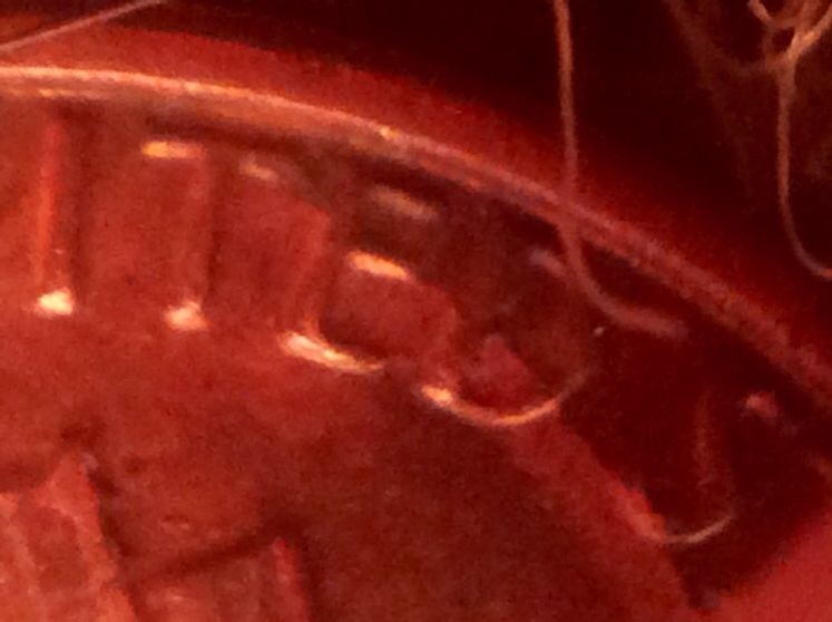Is-This-From-Someone-Squeezing-Something-On-This-Penny
