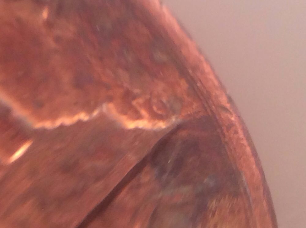 Is-This-From-Someone-Squeezing-Something-On-This-Penny