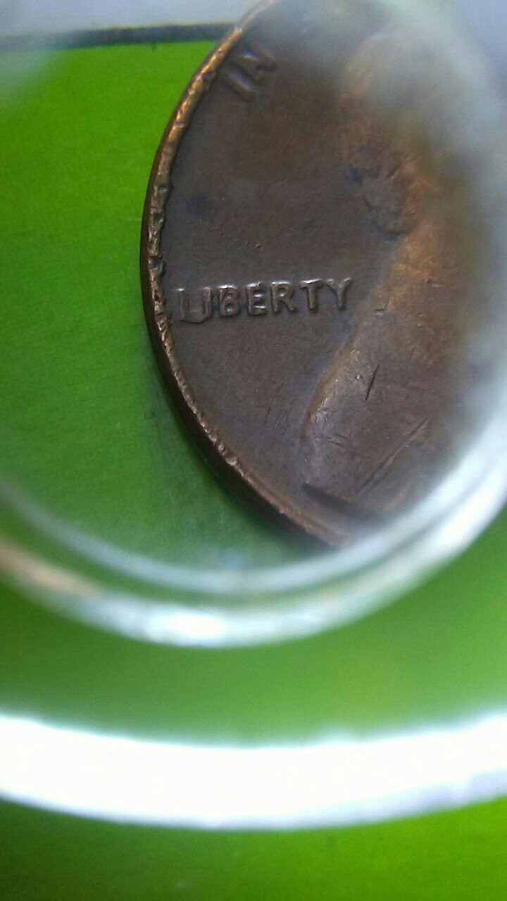 Any-Input-On-The-Li-On-This-Penny.-It-Looks-Like-A-U.