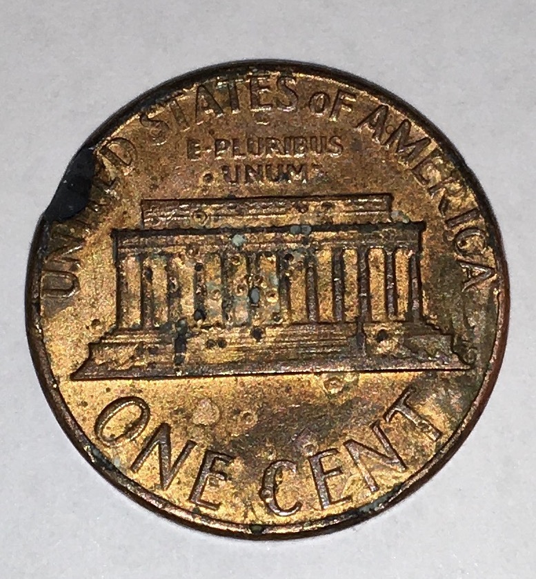 Strange1983-Lincoln-Cent.the-Rim-Is-Broken-With-Copper-Dots-On-Reverse