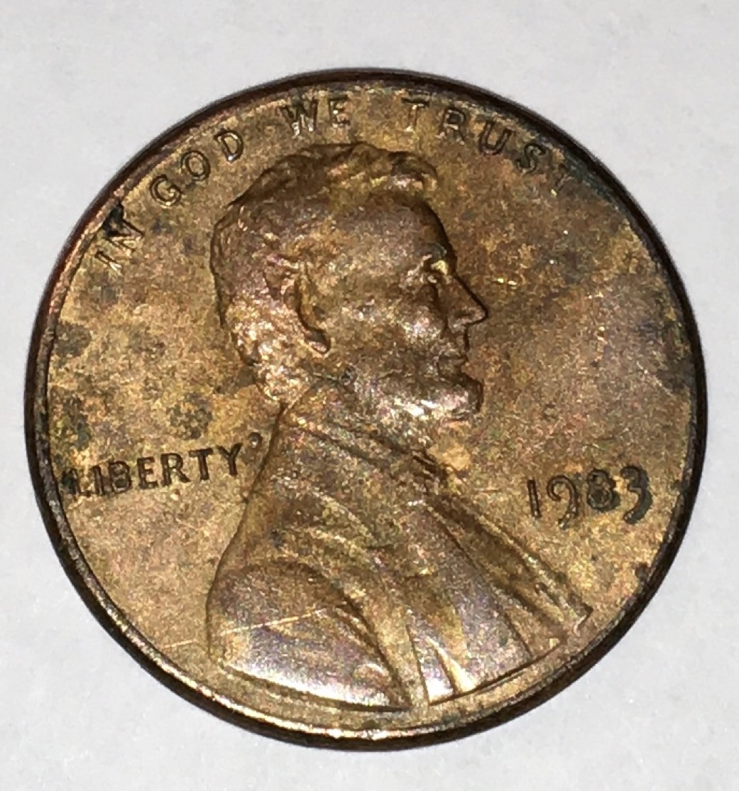Strange1983-Lincoln-Cent.the-Rim-Is-Broken-With-Copper-Dots-On-Reverse