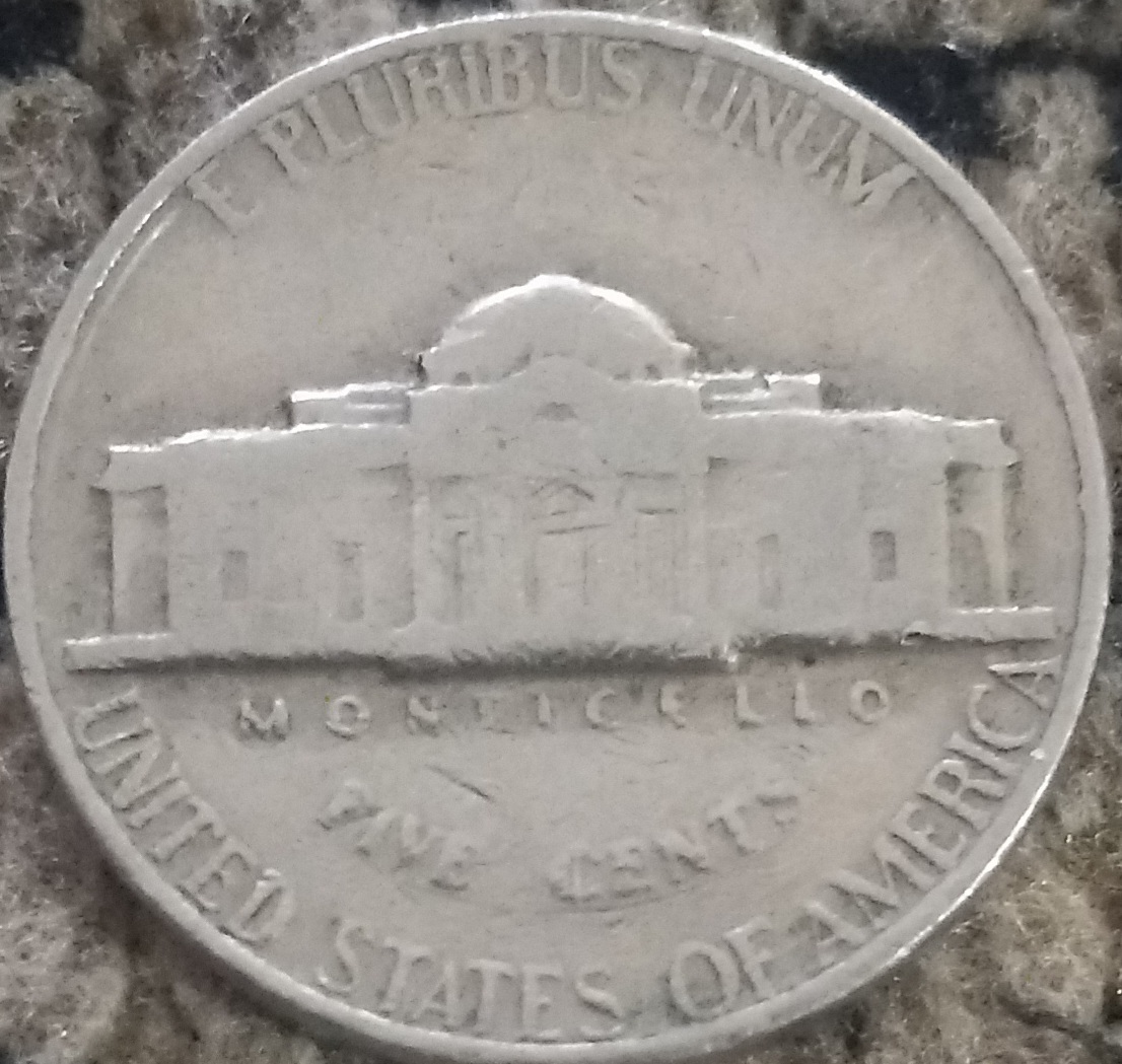 Is-This-1970-D-Nickel-An-Error?--The-Outer-Rim-Is-Overlaying-The-Letters-In-God-We-Trust-On-The-Fron