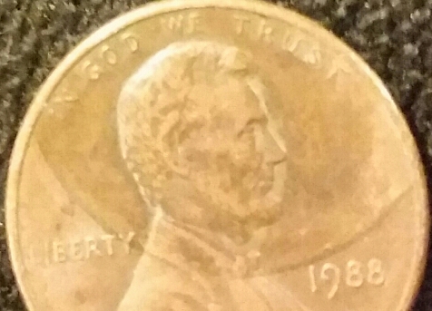 1988-D-Lincoln-Penny-With-A-Size-Of-A-Penny-On-Part-Of-Lincoln's-Head-Obv