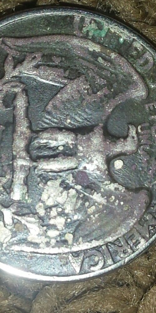 Strange-Looking-Quarter-Covered-In-Black
