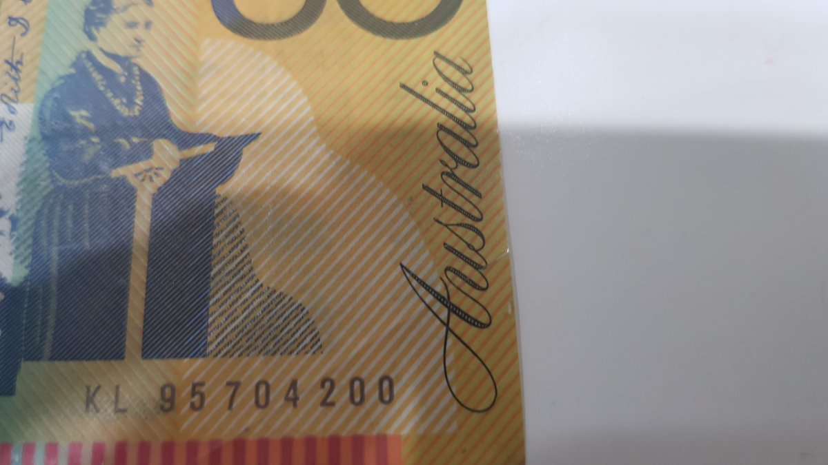 1995-What-Was-The-Mint-Doing-That-Made-The-50-Dollar-Being-Cut-Off-Centered