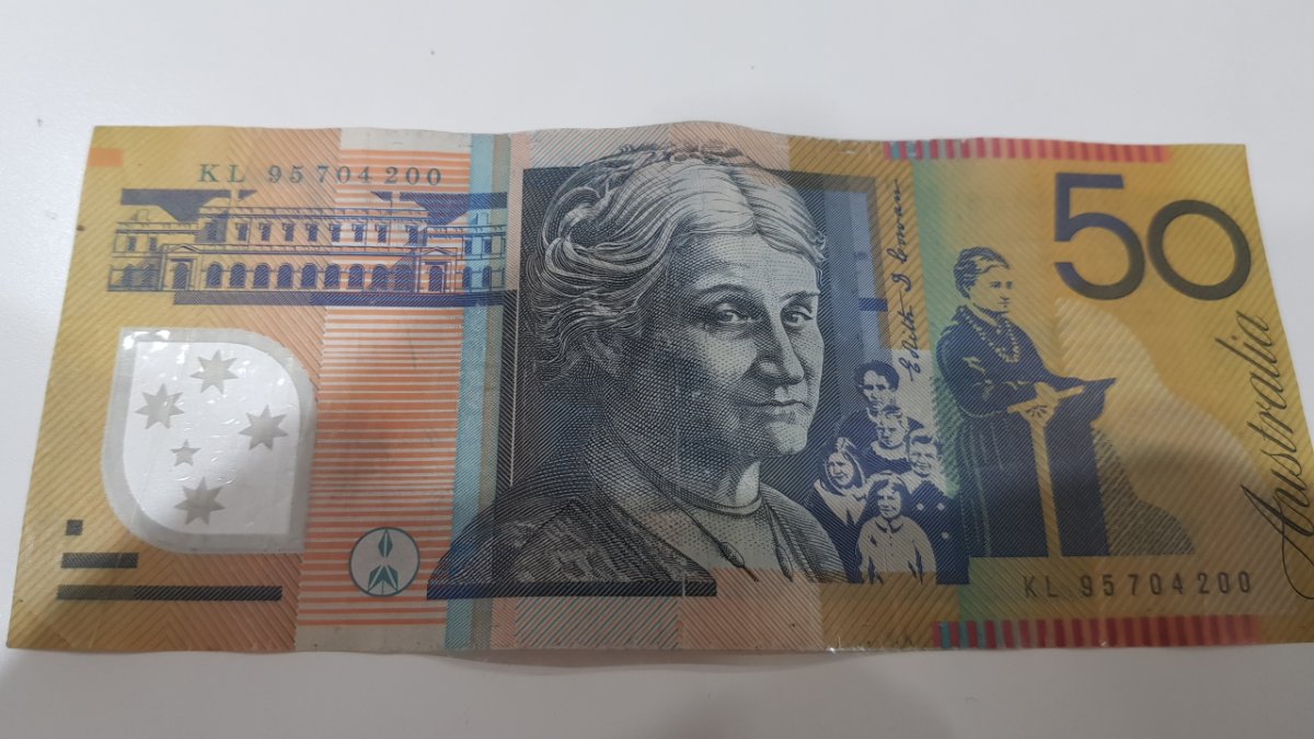 1995-What-Was-The-Mint-Doing-That-Made-The-50-Dollar-Being-Cut-Off-Centered