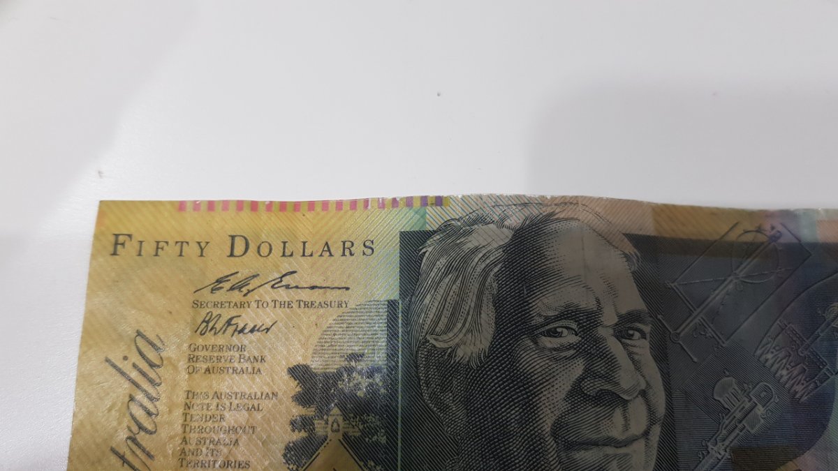 1995-What-Was-The-Mint-Doing-That-Made-The-50-Dollar-Being-Cut-Off-Centered