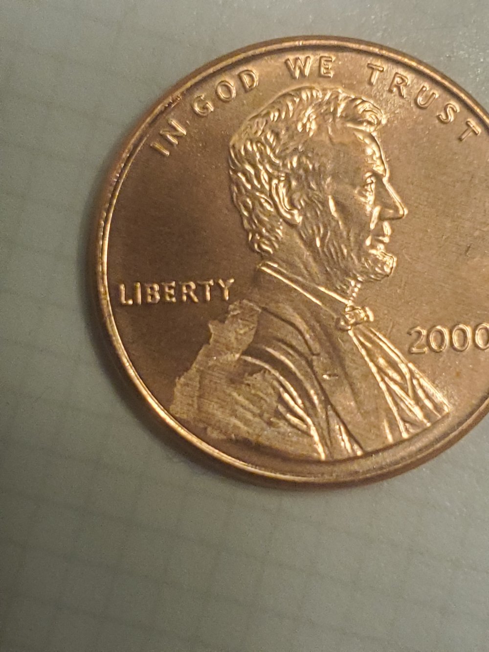 2000-P-LMC-Struck-Through-Obverse-Possible-Cloth/Paper-Strike-Through?