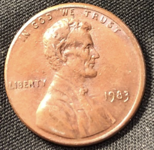 1983-Lincoln-Cent--I-Believe-The-Devices-Are-Reduced-In-Size?