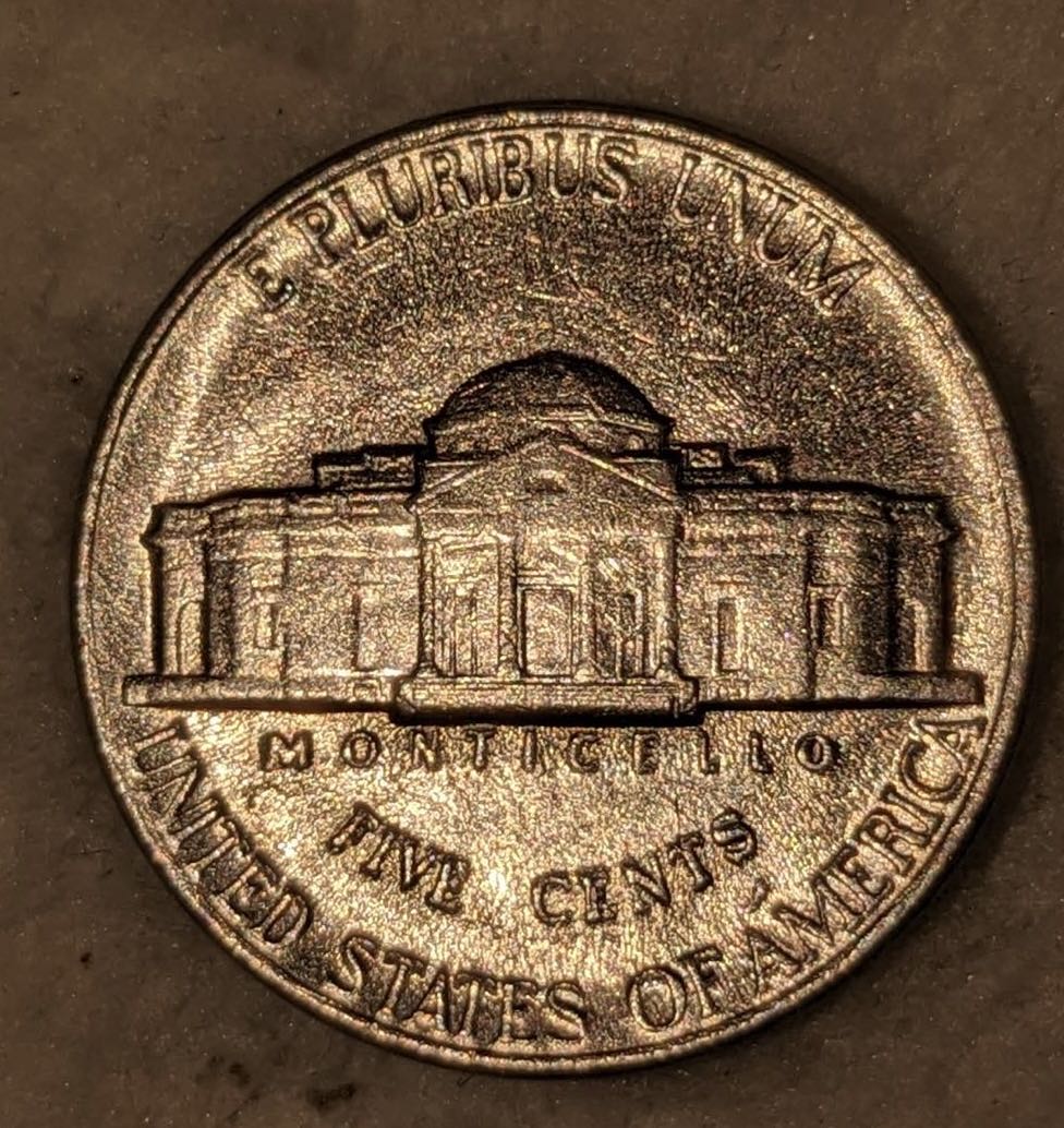 Can-Someone-Tell-Me-What's-On-This-1989-Dmint-Nickel