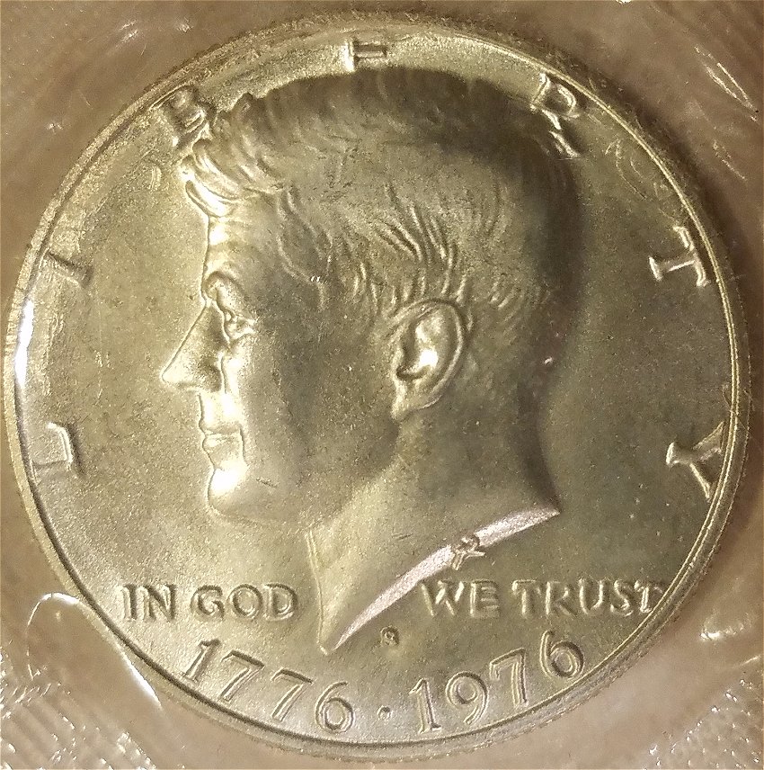 1989-Quarter-Struck-On-1976-Bicentennial-Kennedy-Half-Dollar