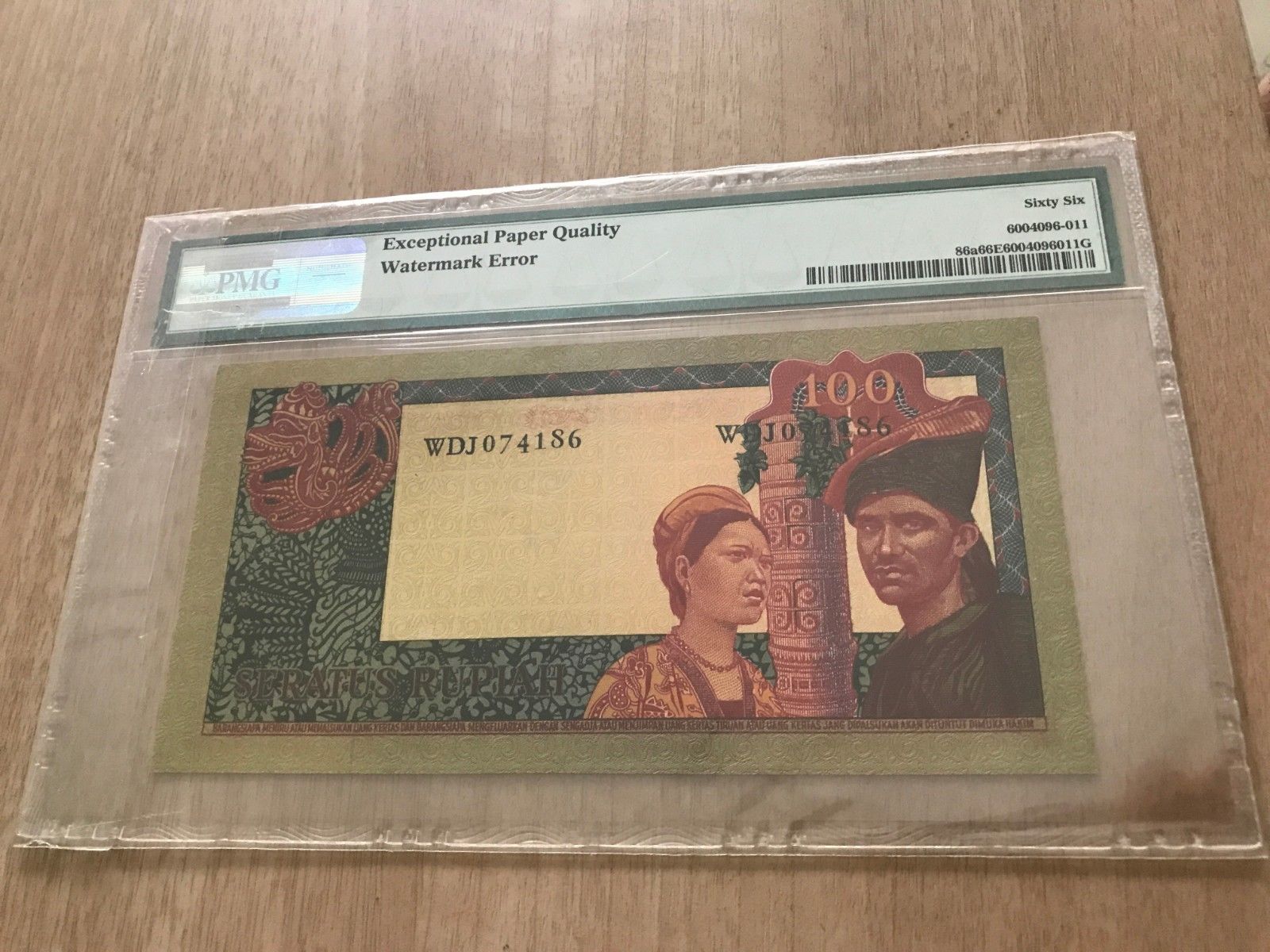 Stolen-Banknote---Indonesia,-1960,-100-Rupiah,-PMG-66EPQ,-Watermark-Error