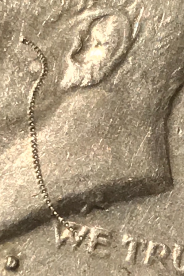 1977-Kennedy-Half-Dollar-With-Really-Cool-Struck-Through-Error-If-Not-I'm-Still-Keeping-It