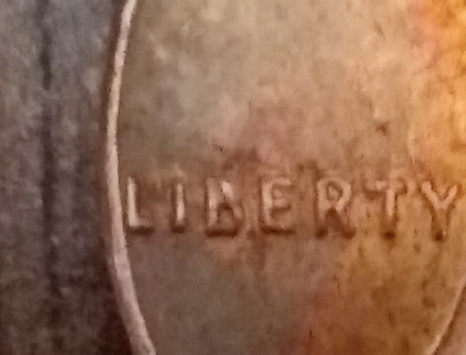 Wheat-Penny-1957-Top-Of-B-Filled-In?