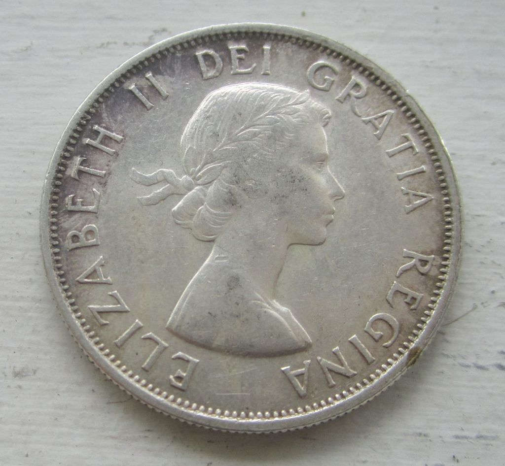 Strange-1955-50-Cents---Mad-Or-Double-Rim-?