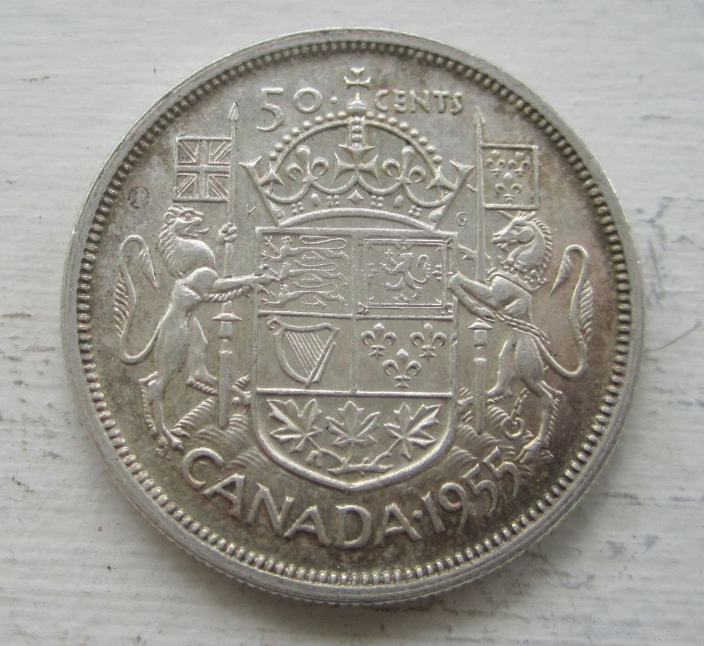 Strange-1955-50-Cents---Mad-Or-Double-Rim-?