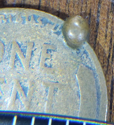 1911-Wheat---Metal-Glob-On-Side