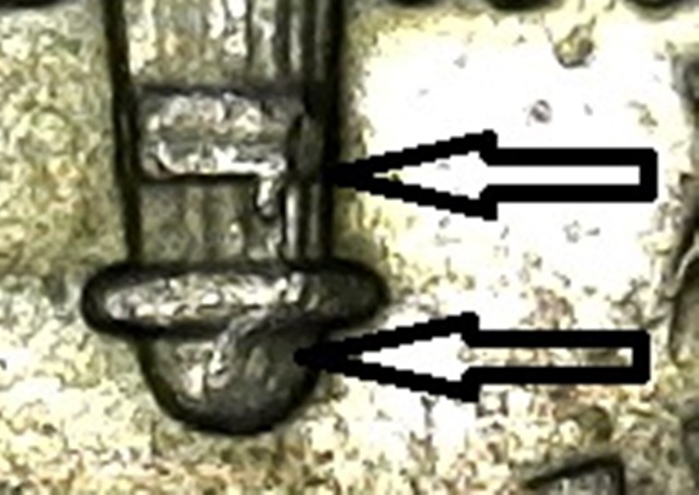 2007-P-Dime-With-Broken-Band-And-Tear-Drop-Like-At-The-Base-Of-The-Torch.