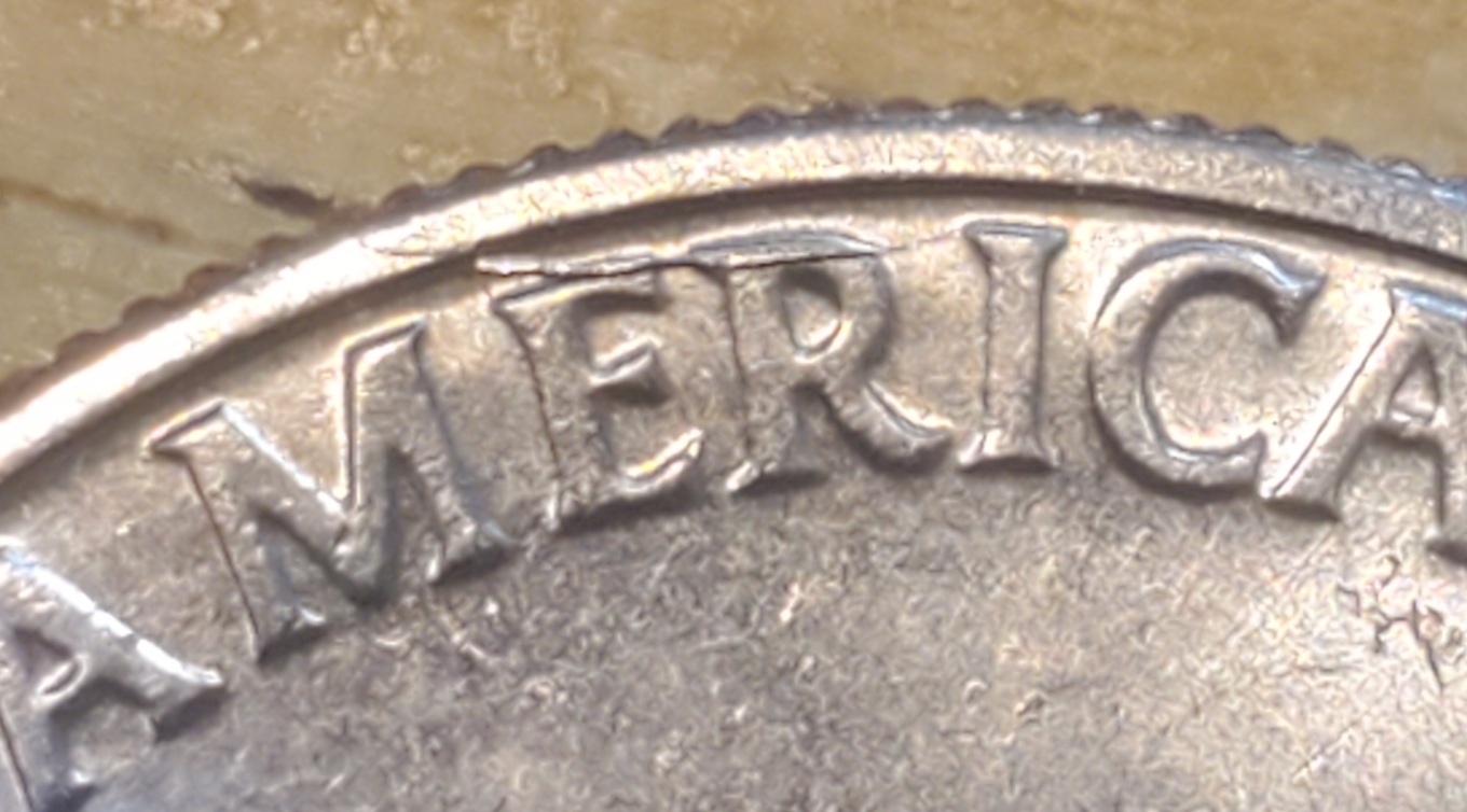 Bicentennial-Kennedy-Half-Dollar-Die-Crack?-The-Mark-Is-Raised-On-The-E-And-R-In-America