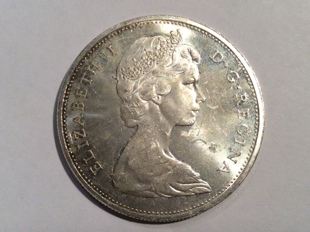 Help-Grade-1965-Dollar