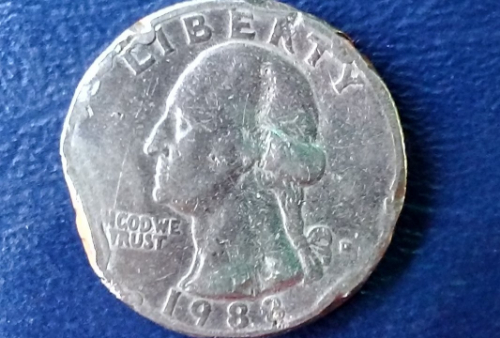 1983-US-Quarter.-Any-Help-With-Identifying-How-It-Became-This-Codition?