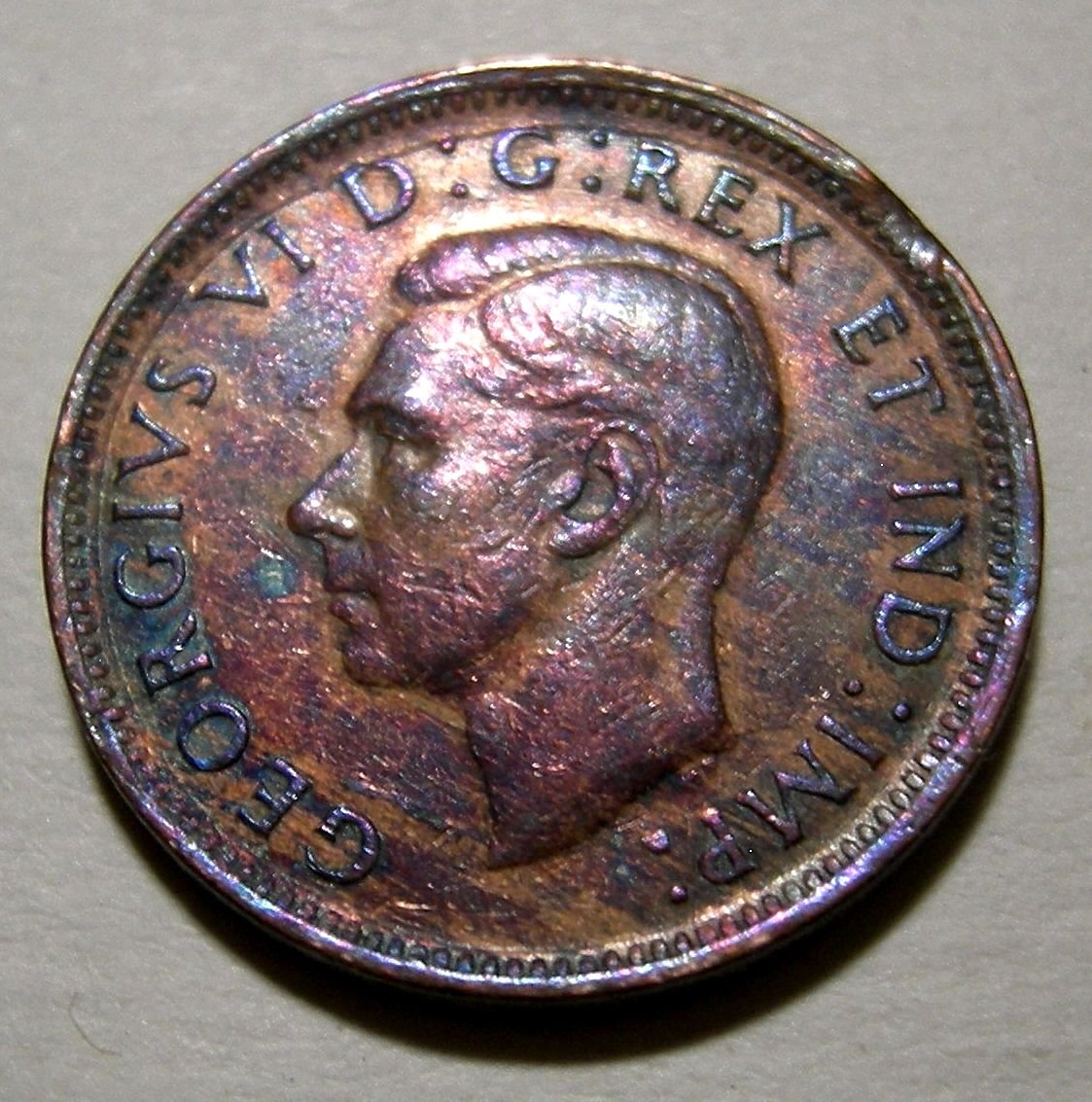 What-Could-Cause-Extreme-Shades-Of-Aqua-Blue-And-Violet-On-George-VI--Cent?