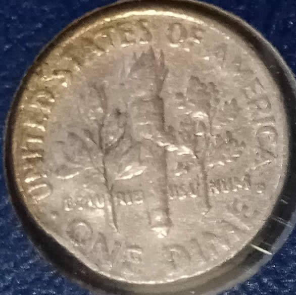 2002-Dime,-With-A-Bubble-On-The-Face-And-Metal-Missing-From-The-Side