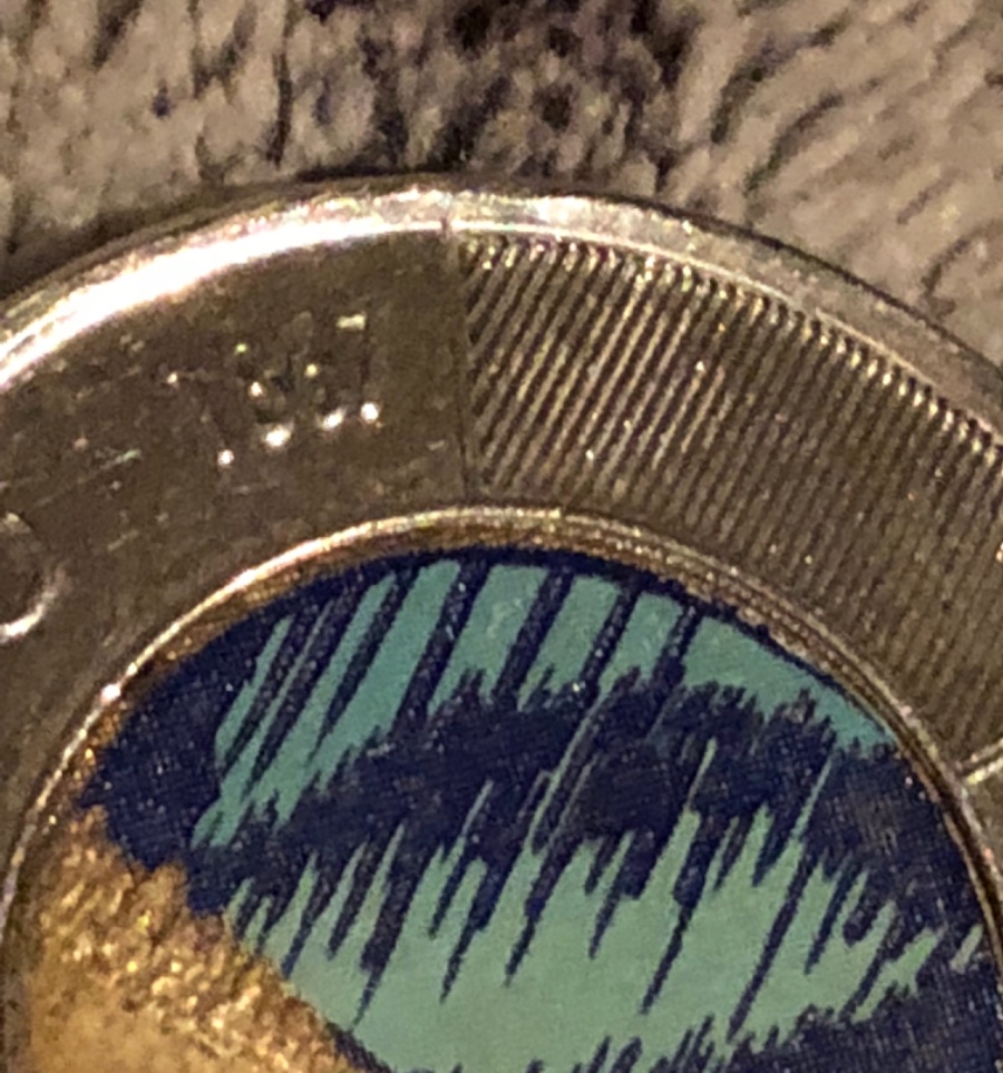 A-2012-Glow-In-The-Dark-Toonie,-Colour-Doesn't-Go-All-The-Way-To-The-Edge