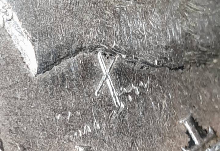 1964-Kennedy-Half-With-3-X-Shaped-Die-Crack-Marks-On-It