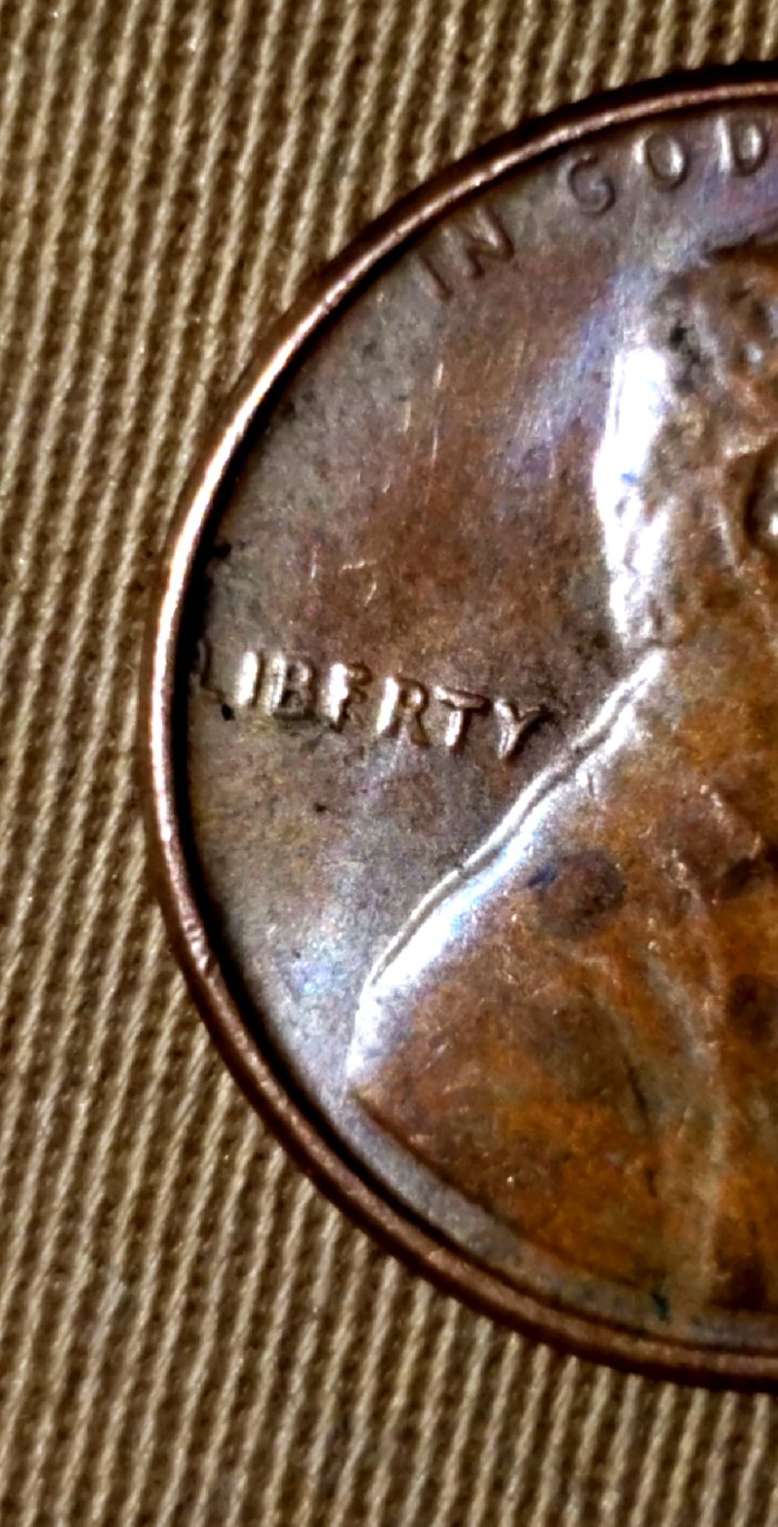 The-E-In-Liberty-Looks-Like-A-F,-And-Below-Liberty-I-See-An-S.-Need-Help-Th