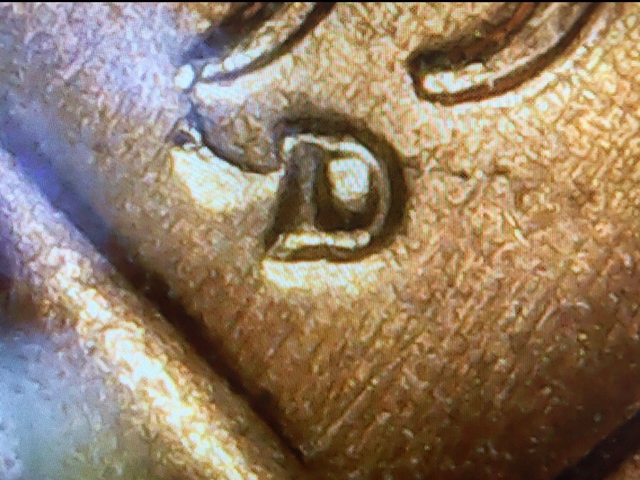1957-D-LWC-Die-Break-On-Head,-Date,-And-What-Looks-Like-A-Wing-On-The-MM?