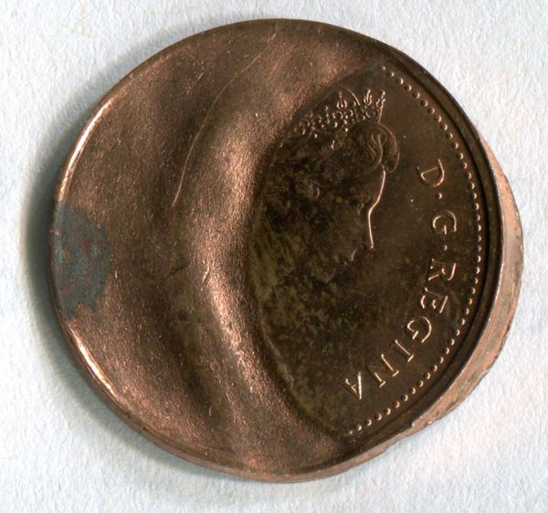 Cent-Weakly-Struck-By-Tilted-Die;-Multiple-Brockages