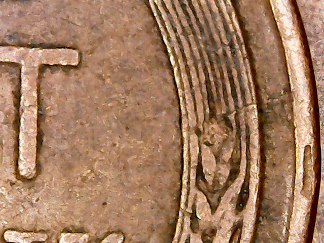 1957-D-LWC-Struck-Through-Debris-Or-Just-Lamination-Issue?