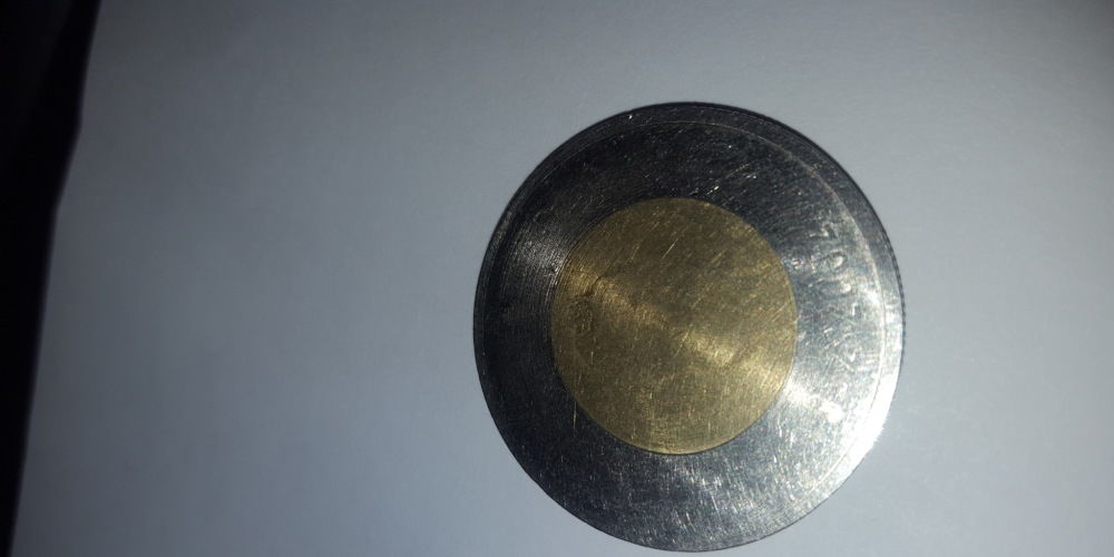 Toonie-Mint-Error-Or-Crushed-By-An-Anvil?