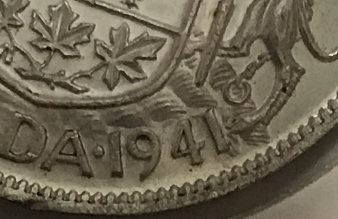 Difference-Between-A-Narrow-And-Wide-Date-On-The-1941/42-Fifty-Cent-Coin
