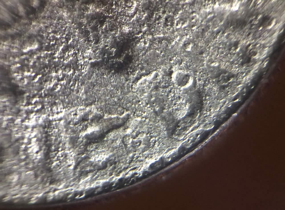 Mint-Damaged-Or-A-Parking-Lot-Dime?