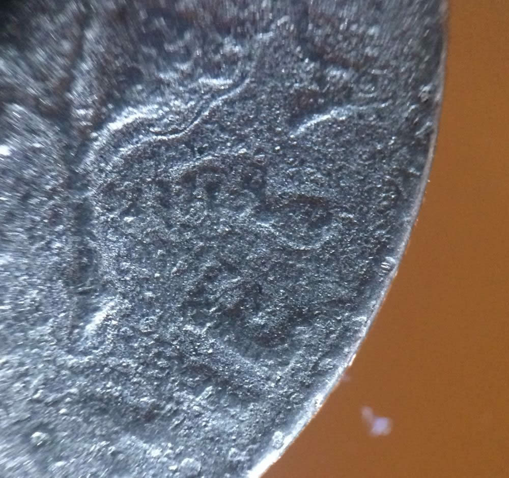 Mint-Damaged-Or-A-Parking-Lot-Dime?