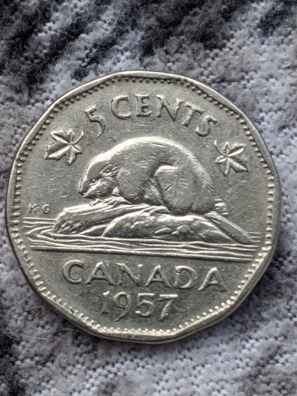 1957-Nickel-Over-Polished-Die-On-Log-Above-Beavers-Tail