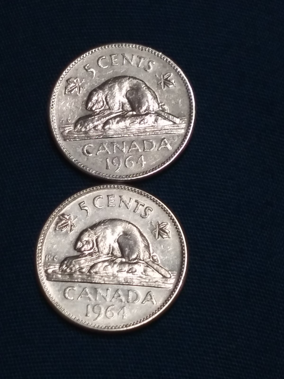 Few-1964-5cent,-Why-Is-The-Left-Leaf-Almost-Touching-The-Rim?