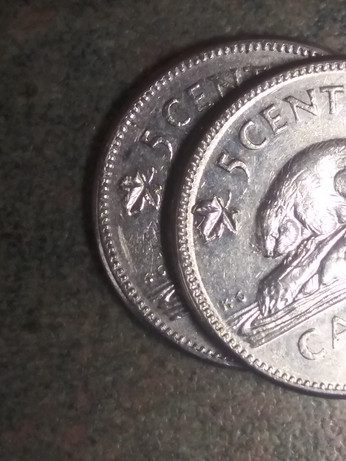 Few-1964-5cent,-Why-Is-The-Left-Leaf-Almost-Touching-The-Rim?