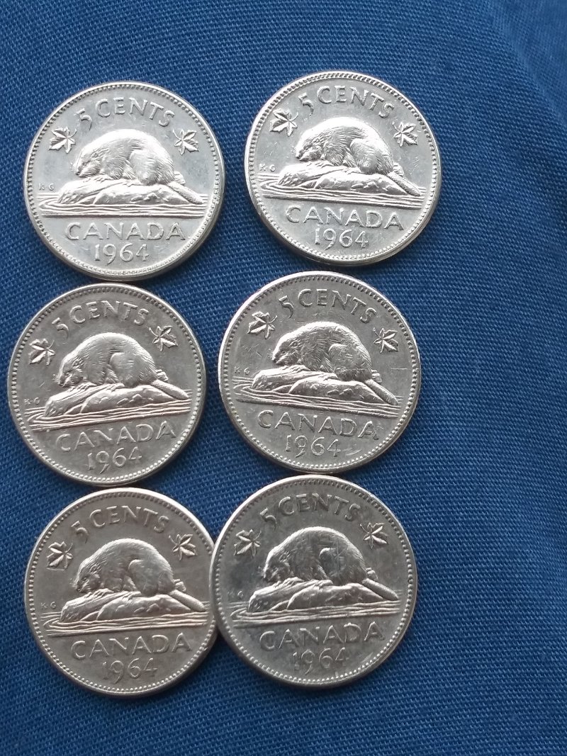Few-1964-5cent,-Why-Is-The-Left-Leaf-Almost-Touching-The-Rim?